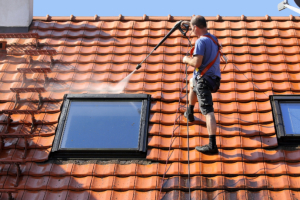 man cleaning the roof